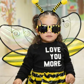 Child dressed as a bee at daycare in Miami participating in fun learning activities