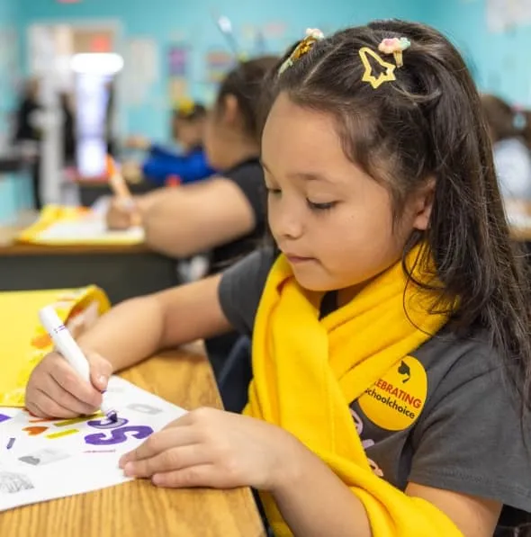 Elementary student drawing during class at a private school in Miami